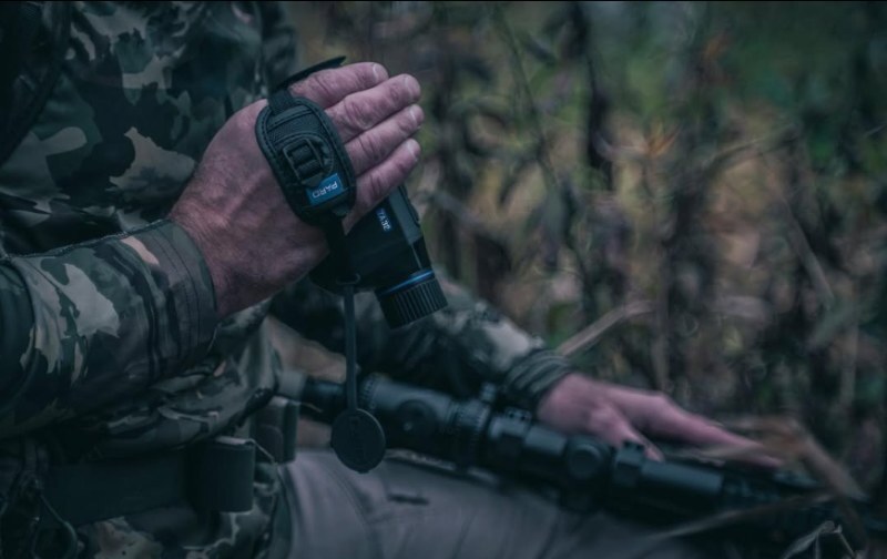 Close-up of PARD TA32/62 Thermal Monocular compact body and lens in user’s hand.