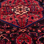 Nahavand Persian Rug 10'3" x 5'4" - Semi Antique Medallion Navy Blue, Red Hand Knotted | side view | SKU 112250