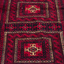 Baluch Persian Rug 7x3 ft - Semi Antique Medallion Toranj Geometric Madder Red Dark Red Burgundy Hand Knotted | side view | SKU 112523