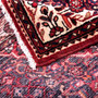 Hosseinabad Persian Rug 10'10" x 3'8" - Semi Antique Medallion Crimson, Ivory Hand Knotted | corner detail | SKU 112850