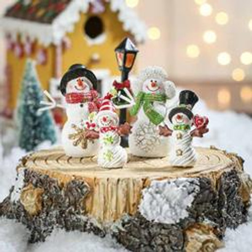 Snowman Family on Tree Trunk