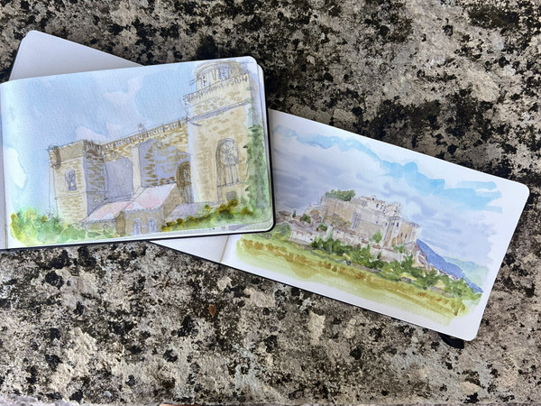 Paintings of a medieval village and castle