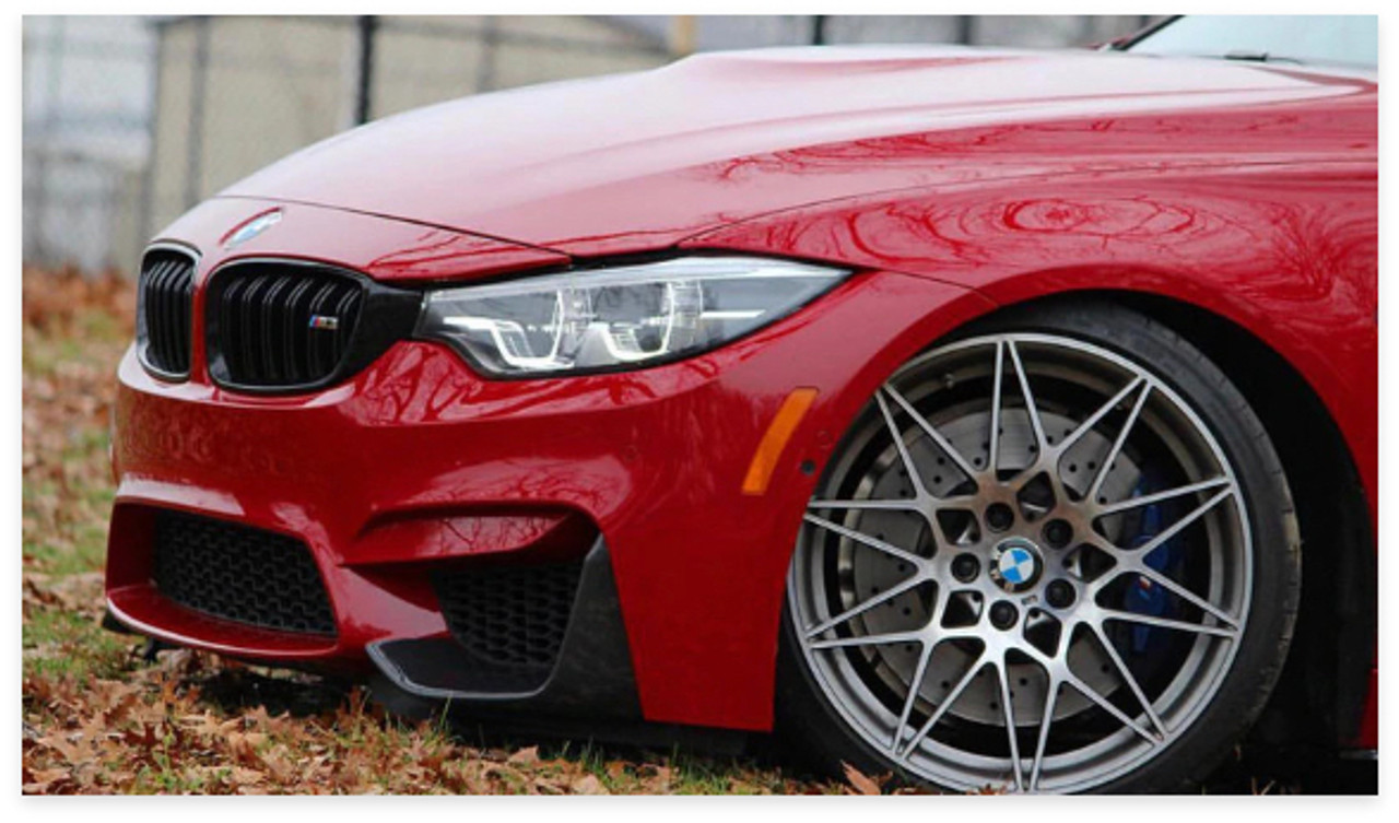 Close up of the front of a red BMW