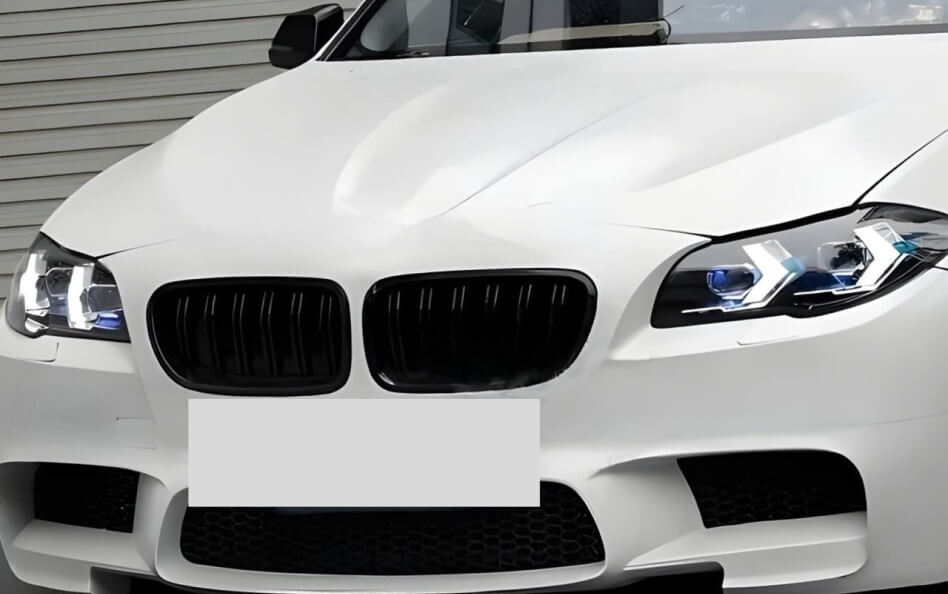 Front angle of a white BMW F10.