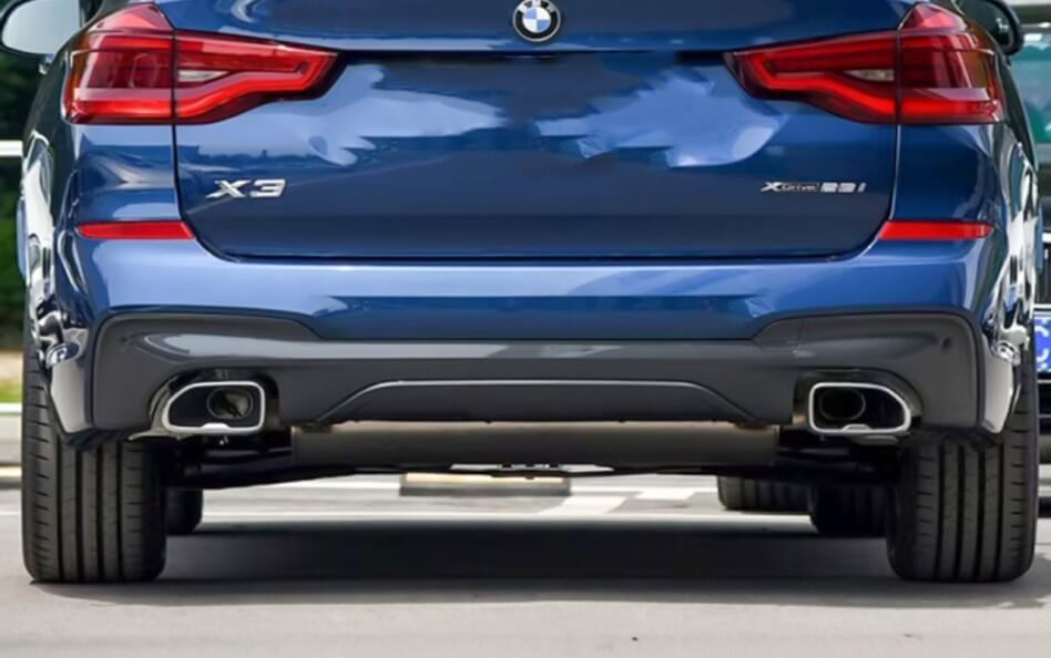 Rear view of a blue BMW X3 xDrive 30i, showcasing its dual chrome exhaust tips, sleek taillights, and all-wheel-drive badging.