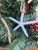 Closeup of Starfish Garland on Christmas Tree Nautical Seasons  Closeup of Starfish Garland on Christmas Tree Nautical Seasons