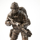 Cold-cast resin modern soldier statue has an antique bronze finish with accurately sculpted clothing, gear, and weapons