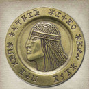 solid brass Aquilonian Luna features King Conan with Basque Euskara inscribed in Phapian, an ancient Minoan script on the rim