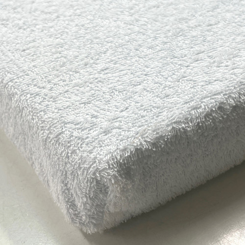 Soft terry cotton waterproof fabric on top side of topper