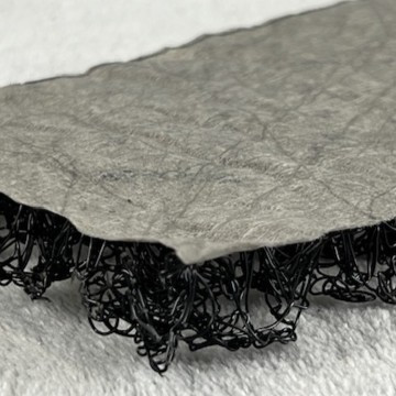 Closeup of corner of AquaShield mattress underlayment top side up