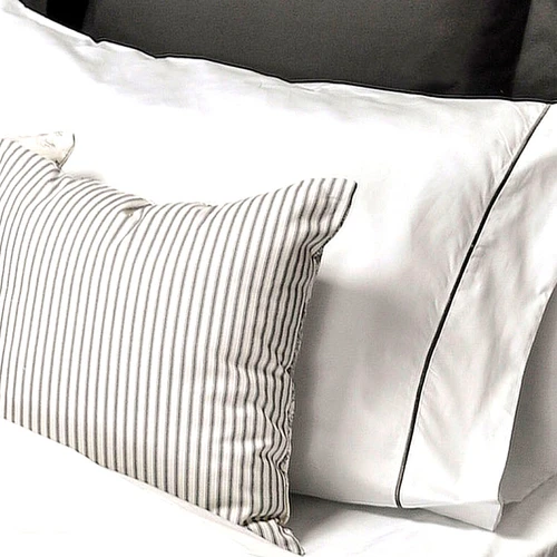 Closeup of Tuscan Traveler pillowcase & ticking stripe throw pillow