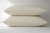 Pair of stacked Cozy Comfort Pillows in natural wheat colored cotton covers