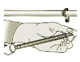 Insert pointed end of screw through fixture into hole in base material.