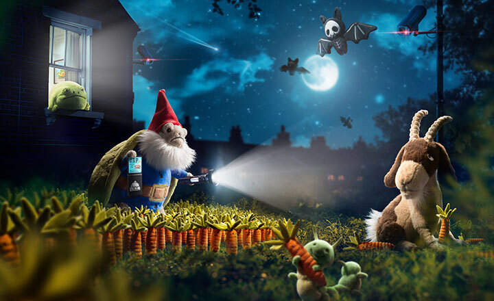 Timmy Turtle Gnome in the garden with flashlight