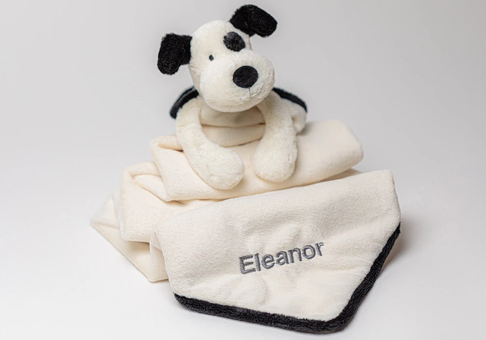 Black & Creme Puppy Soother with grey embroidered name "Eleanor" 