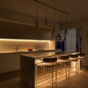 Warm White LED neon rope light lighting the underneath of cabinets and a kitchen island