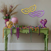 entryway decorated with Mardi Gras purple and gold carnival mask light