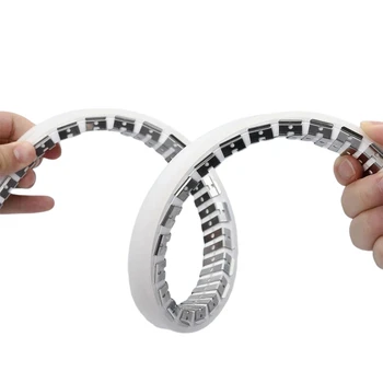 Flexible metal track for neon being held in someone's hand
