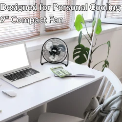 image of seasons comfort black 9 inch fan on a desk