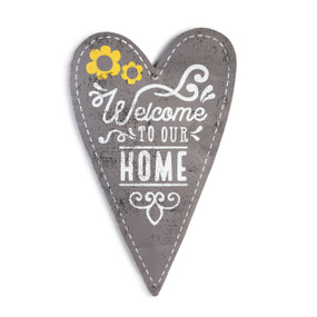 metal wall hanging painted and shaped like a gray heart with Welcome to our Home painted in center in white