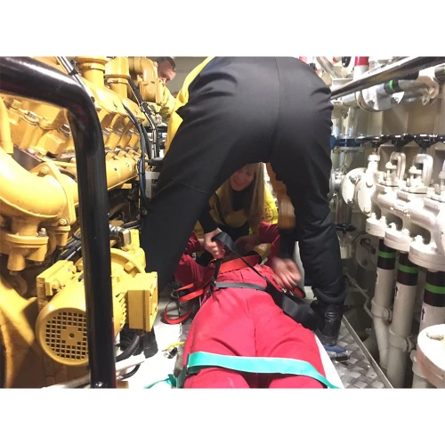 Confined space rescue in action with an emergency responder attending to a patient