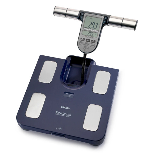 Omron BF511 digital body composition monitor showing large LCD screen and detachable handheld unit with metal sensors and control buttons.