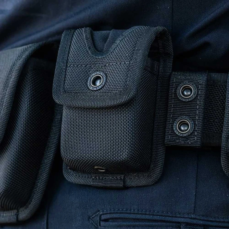 A black sierra bravo latex glove belt pouch by 5.11 Tactical clipped to a belt showing a popper detail