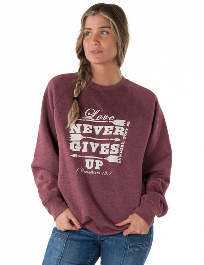 Love Never Gives Up Ladies Fit Crew Neck Sweatshirt (wine)