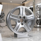 16-inch ford taurus factory original wheel 3385 OEM rim part YF1Z1007BA, angle view in the showroom