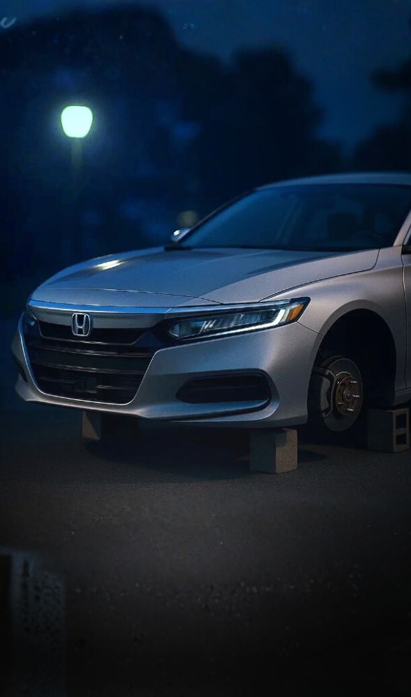 OEM replacement rims for stolen wheels. Honda Accord missing wheels on blocks.