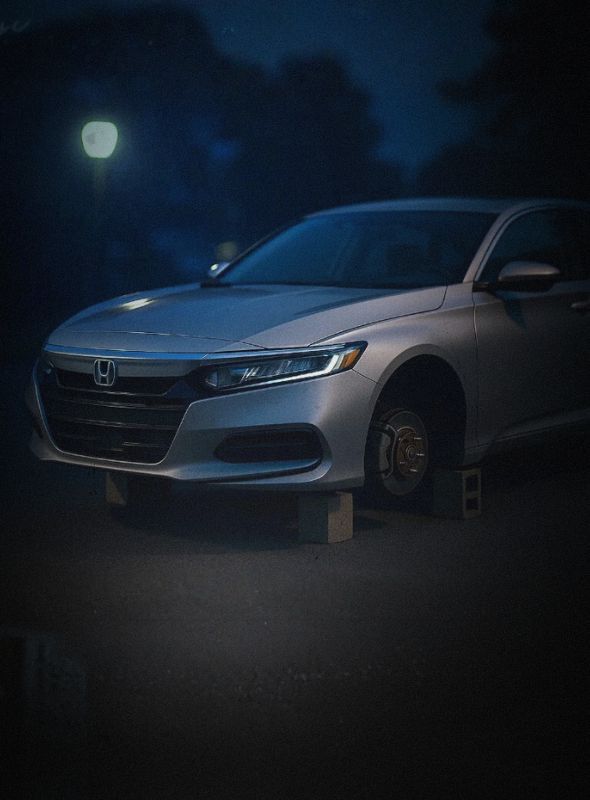 OEM replacement rims for stolen wheels. Honda Accord missing wheels on blocks.