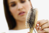 WHAT IS POSTPARTUM HAIR LOSS?