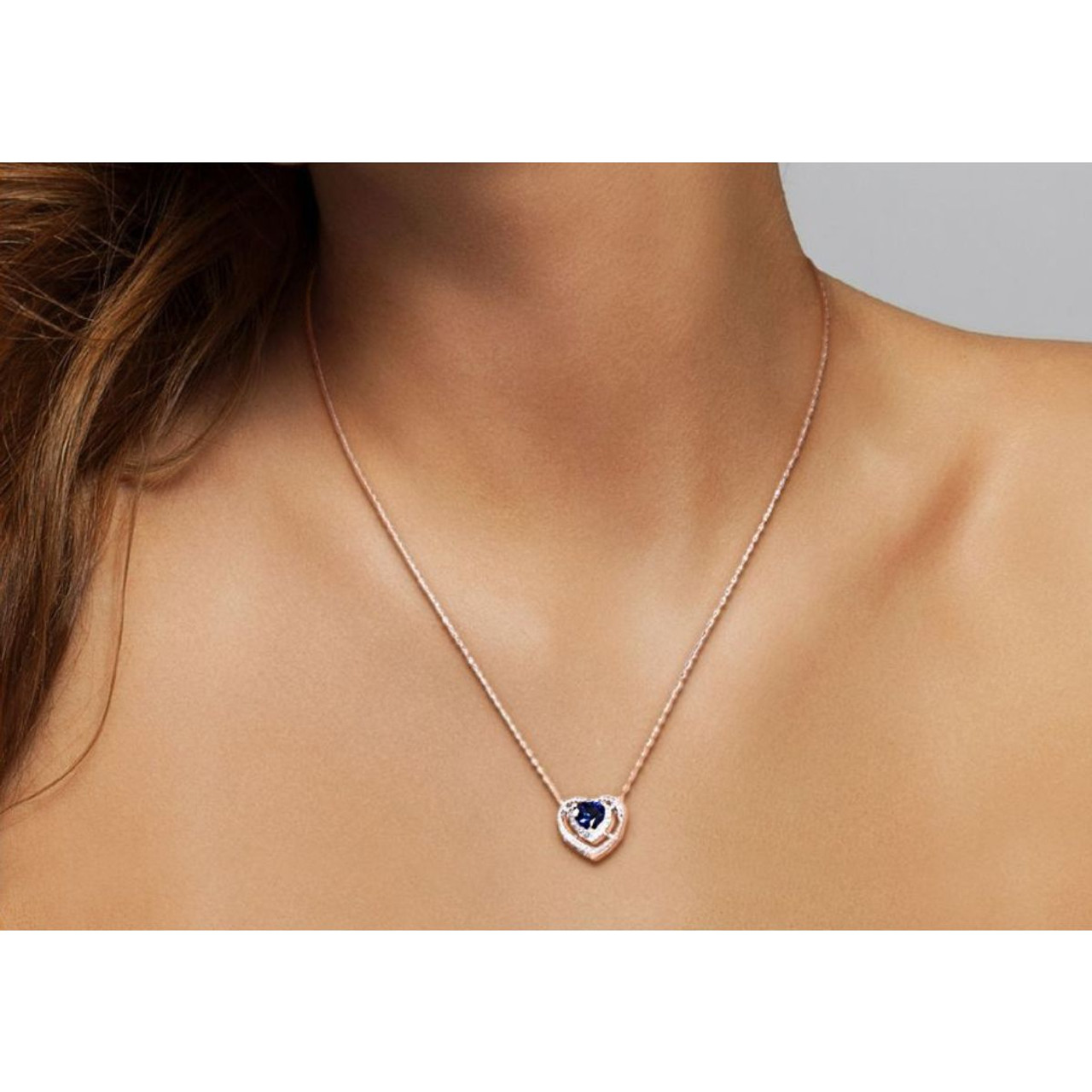 4/5 Carat (ctw) Lab-Created Blue Sapphire Halo Heart Pendant Necklace product image 4/5 Carat (ctw) Lab-Created Blue Sapphire Halo Heart Pendant Necklace product image