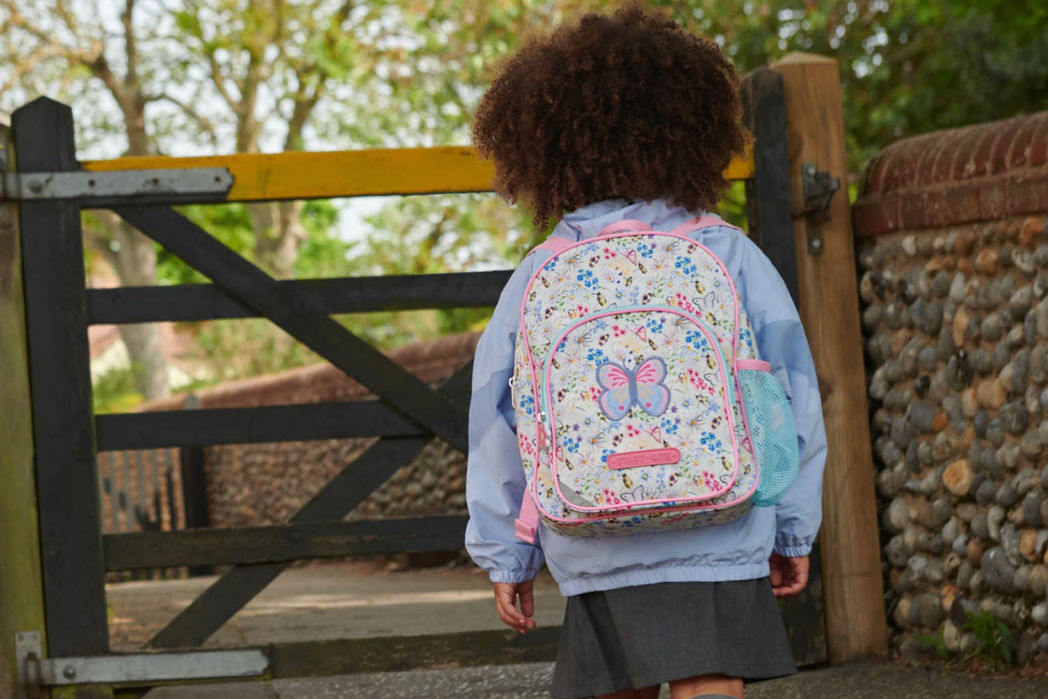 Schoolgirl with backpack on walking to school