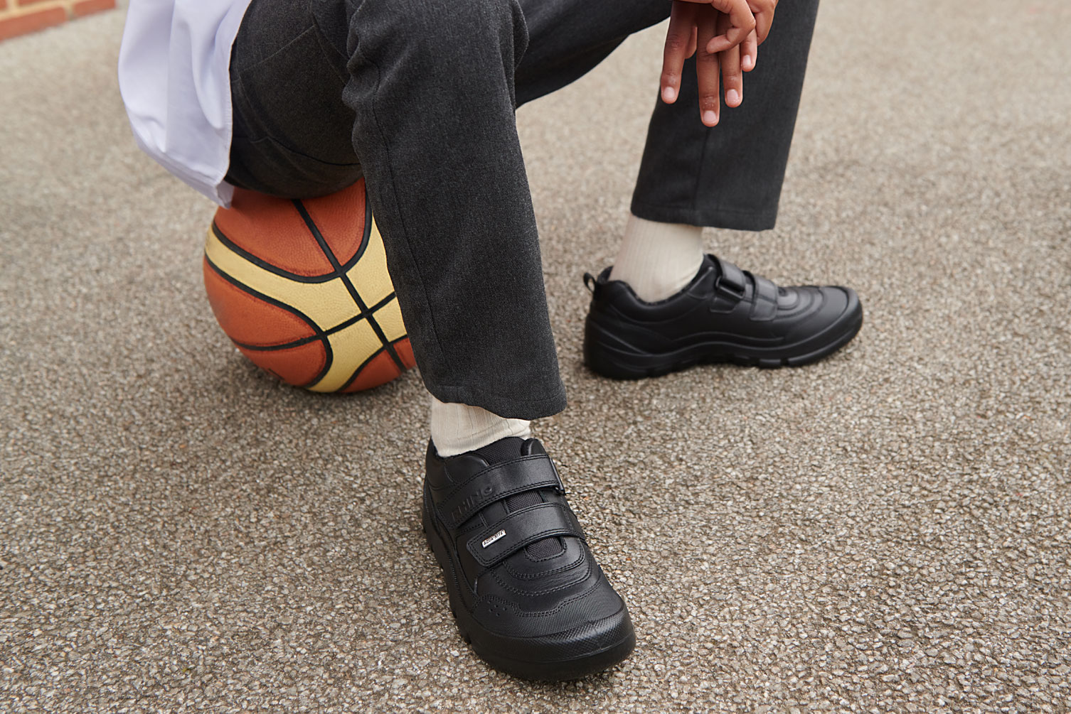 a boy in a  pair of new children' shoes