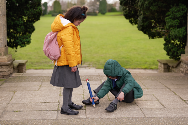 school children boy and girl playing