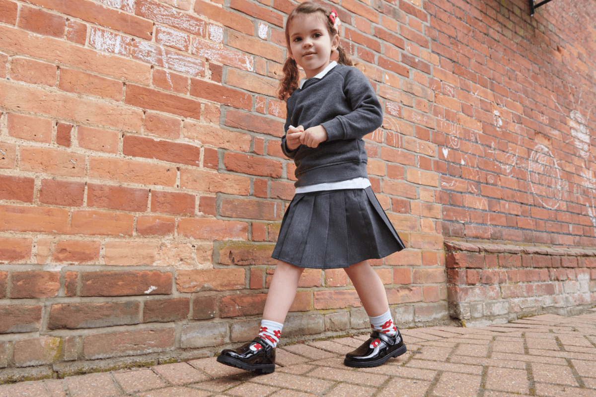 Young school girl in uniform