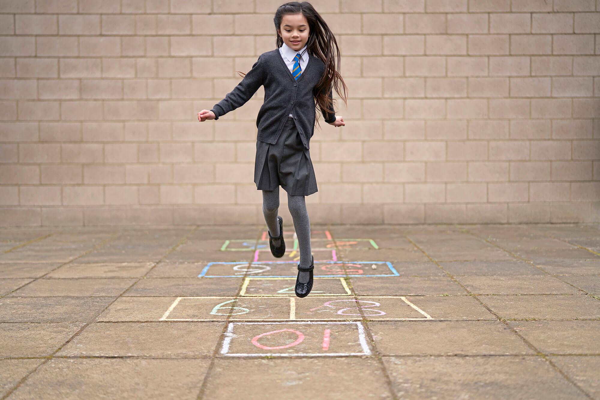 Girl Playing Hopscotch