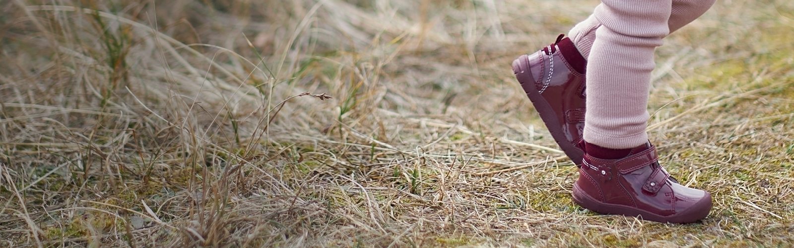 Girl in Start-Rite Boots walking in field