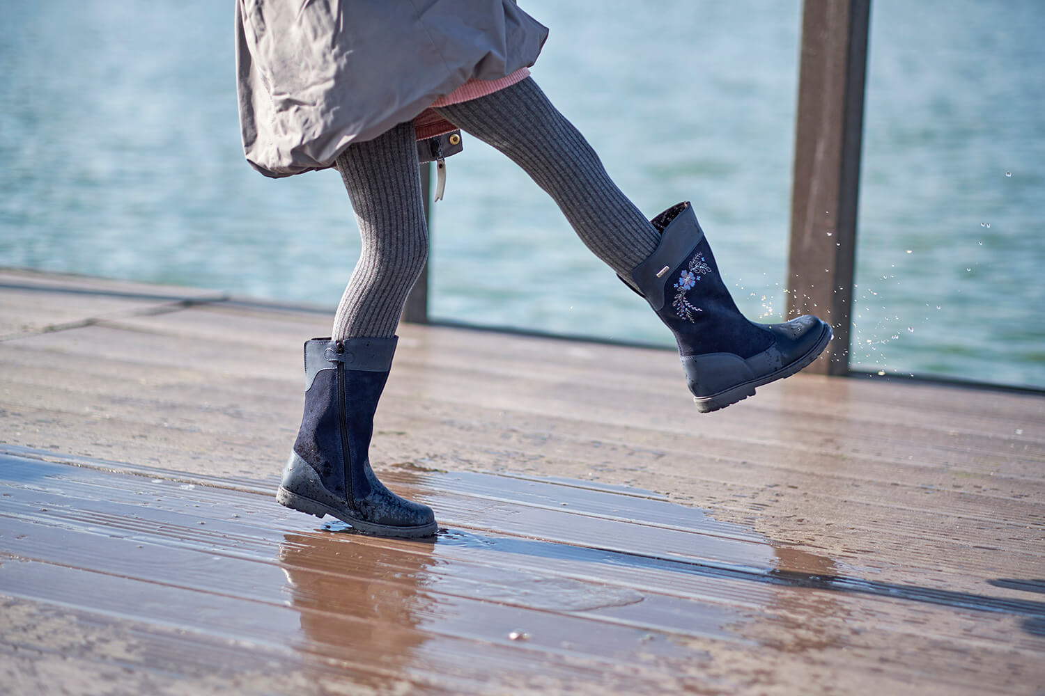 Girl Splashing in Puddles