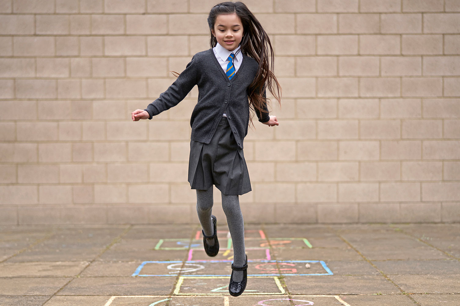 Girl jumping in Start-Rite shoes