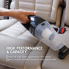 Handheld cordless vacuum cleaning a car seat to show high performance power for high drain applications.