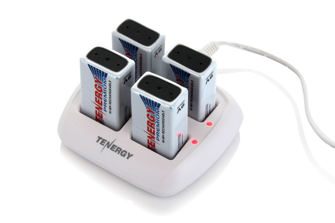 A compact battery charger connects via AC adapter to simultaneously refresh four Ni-MH high capacity batteries.