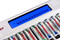 Illuminated blue LCD screen displaying the real-time charging status of individual NiMH rechargeable batteries.