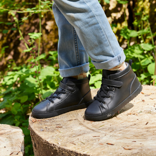 Child wearing Hudson Black sneakers Child wearing Hudson Black sneakers