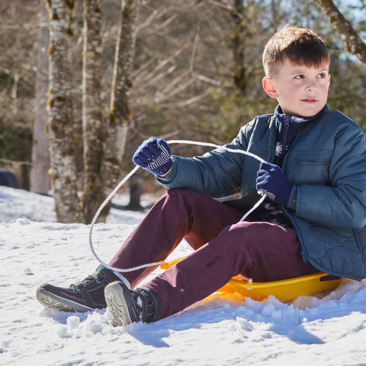 Boy sledding in the Atlas III Waterproof/Insulated Black boots Boy sledding in the Atlas III Waterproof/Insulated Black boots