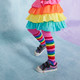 Lifestyle photo of a child wearing rainbow clothes and the Robyne Black Leopard