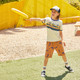 Boy throwing a frisbee, wearing Stevie Black Denim