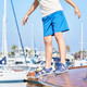 Lifestyle photo of boy on a boat wearing the Wilder II Navy Lifestyle photo of boy on a boat wearing the Wilder II Navy