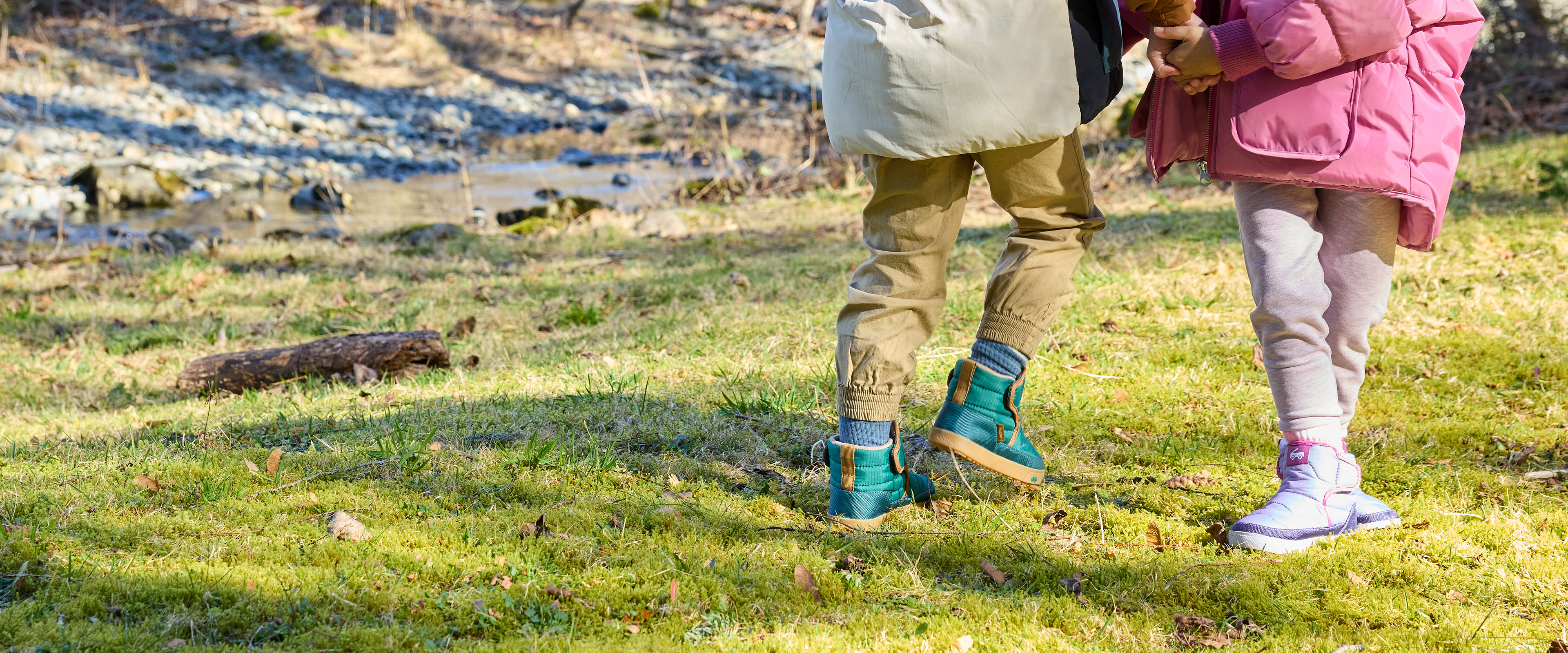 Two boy and one girl toddlers wearing First Walker styles from the Fall/Winter 2025 Collection.